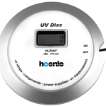 UV Disc handheld meter for measuring UV dose in UVA, UVB, UVC, and LED light sources with display.
